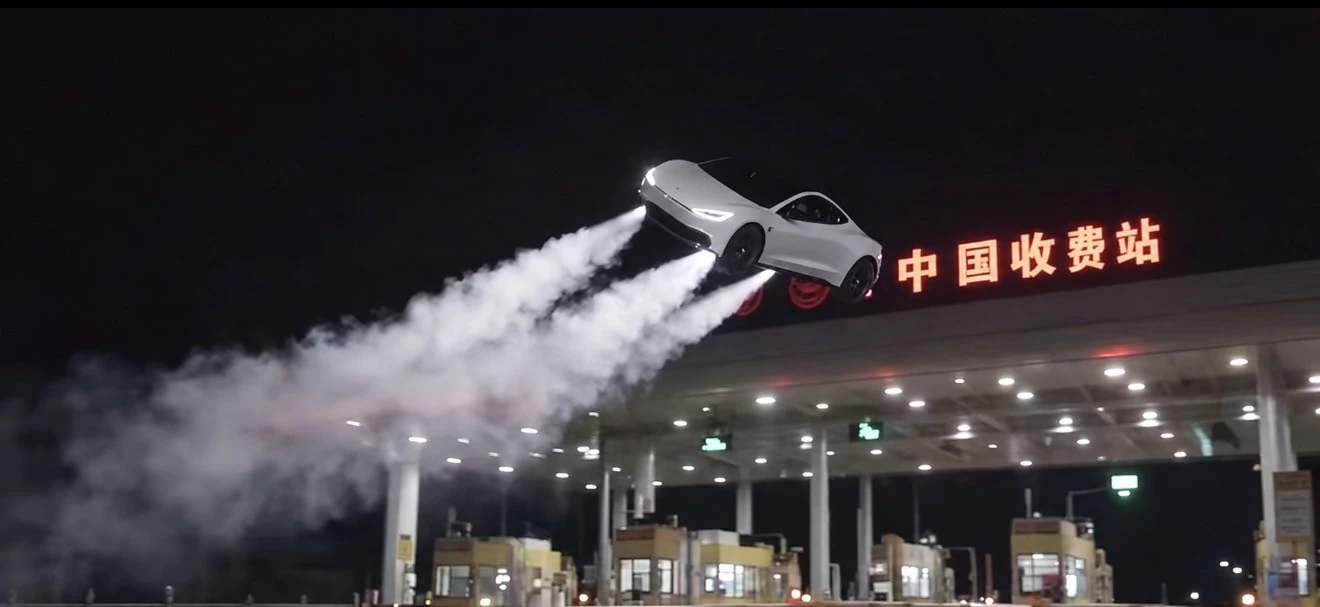 Tesla Roadster flying over a toll plaza